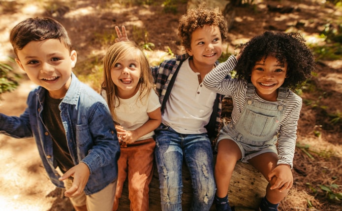 Two children playing with toothbrushes