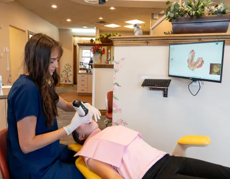 A patient receiving digital dental impressions